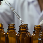 lab technician examining the contents of a dropper bottle