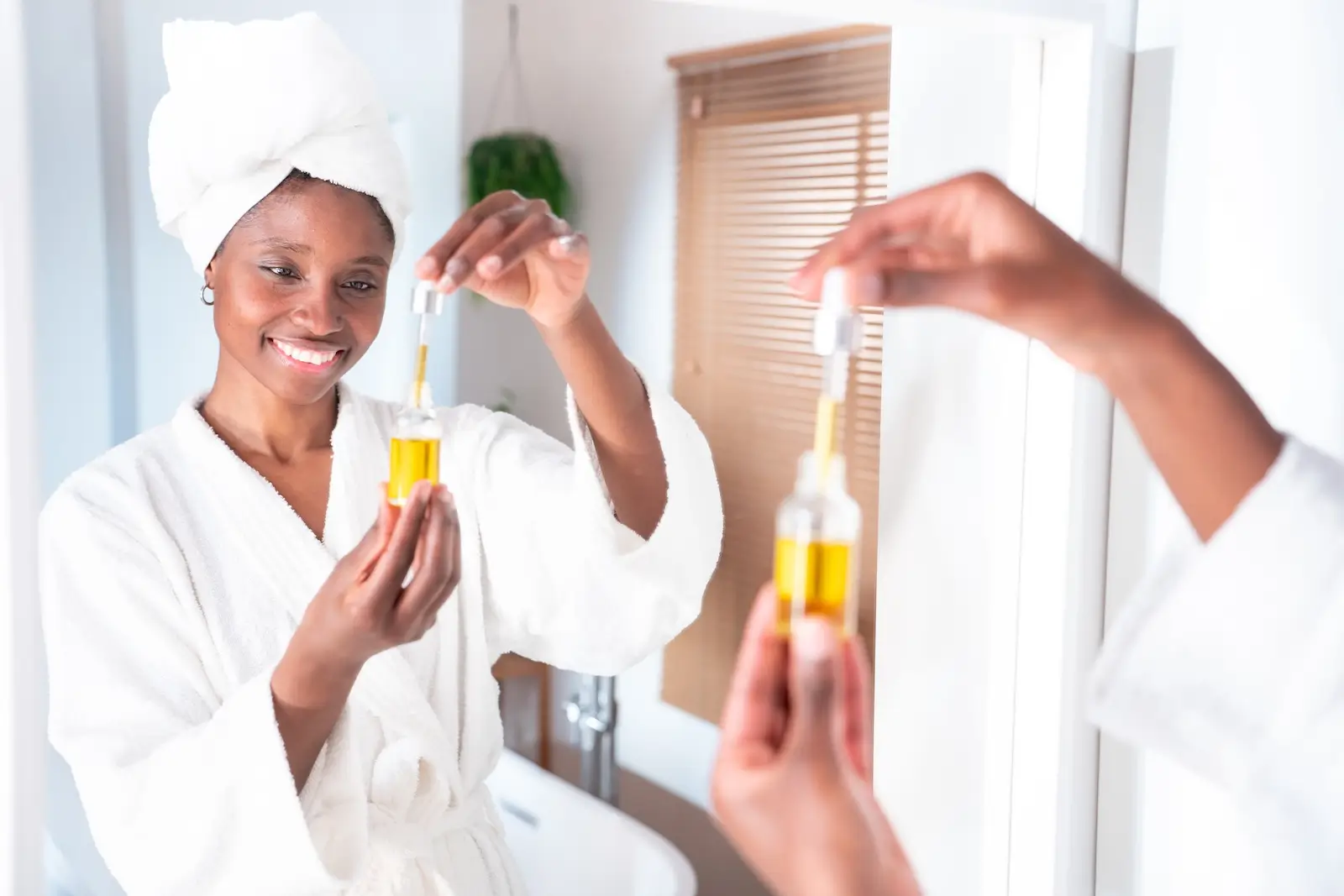 attractive black woman puts on cosmetic natural oi 2025 01 09 15 09 25 utc
