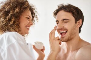woman applying cream to her man in bathroom and la 2024 11 14 05 55 00 utc